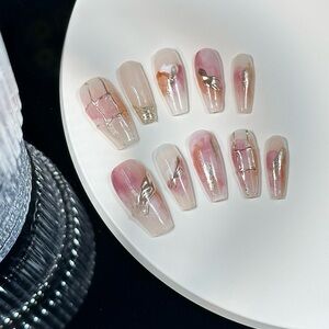 Press-on nails pink and gold champagne smudge